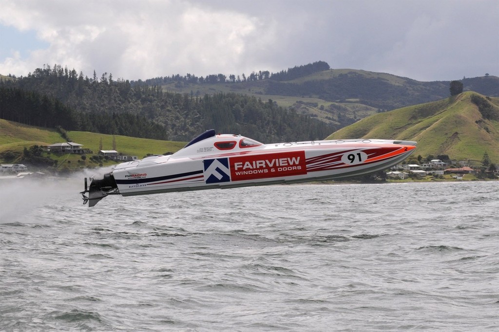 ’Fairview Windows and Doors’ at wide open throttle as it clears the water surface on its way to the chequered flag at Whitianga last weekend.  © Greg Olsen